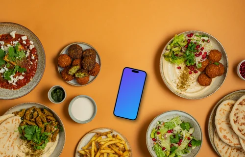 Smartphone mockup with Middle Eastern dishes