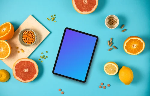 Tablet mockup with oranges and pills