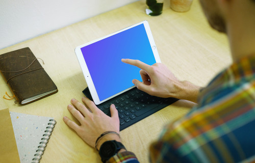 Tapping on iPad Pro mockup with keyboard