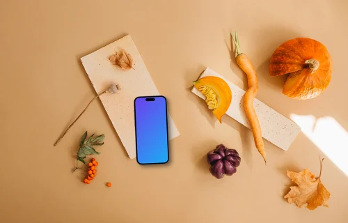 Top view of smartphone mockup surrounded by vegetables