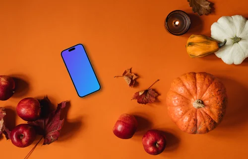 Top view of smartphone mockup with halloween decorations
