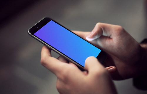 Typing on iPhone 6 mockup in the underground