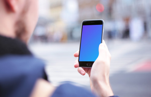 Waiting with iPhone 6 mockup on crosswalk