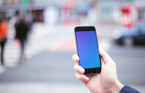 Walking with iPhone 6 mockup on crosswalk