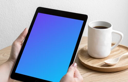 Woman holding iPad Pro mockup