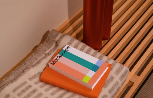 A-format book mockup on a wooden bench with decor
