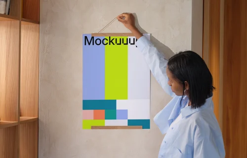 A3 poster mockup held against a textured wall