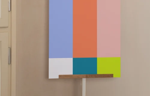 A3 poster mockup with wooden hanger in a neutral interior