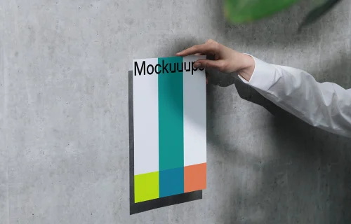 A4 mockup held against a concrete wall