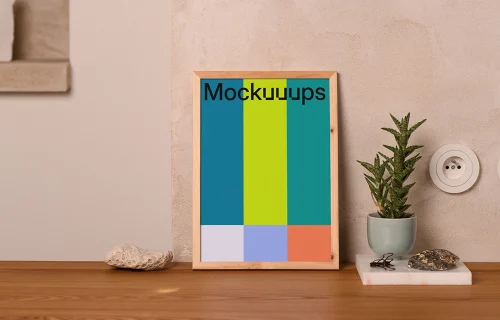 A4 mockup with wooden frame on a tabletop