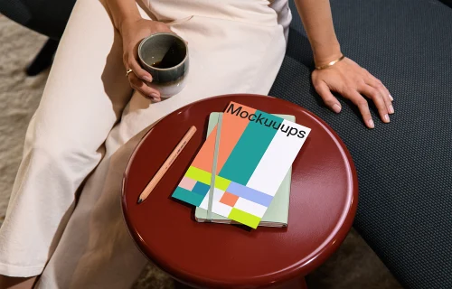 A4 paper mockup on a red round side table