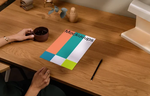A4 paper mockup on a wooden desk