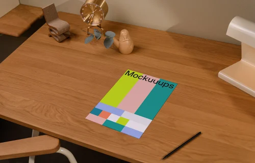A4 paper mockup on a wooden desk with decor