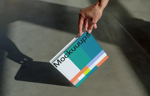Book mockup with a gradient cover and hand detail