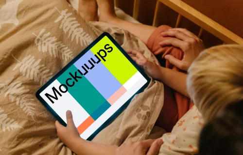 Boy's hands holding an iPad Air mockup