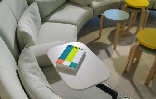 C-format book mockup on a modern lounge table