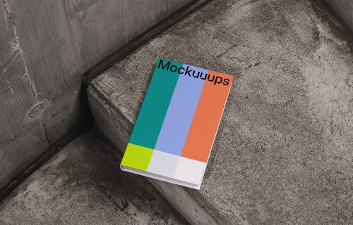C-format book mockup on concrete stairs