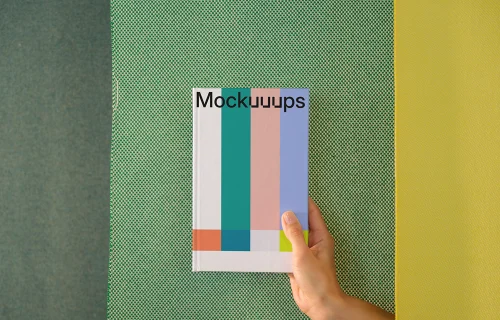 C-format book mockup with geometric background
