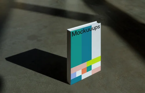 C-format book mockup with gradient cover on concrete surface