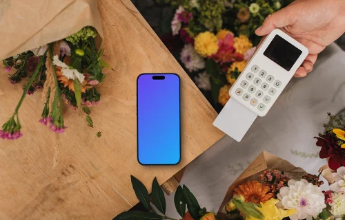 Card transaction in flower shop and an iPhone mockup