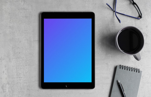 Center view of iPad Pro mockup on the gray table