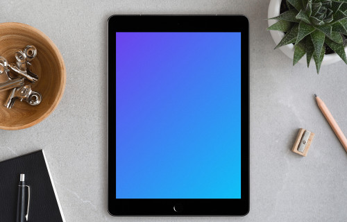 Center view of iPad Pro mockup on working desk