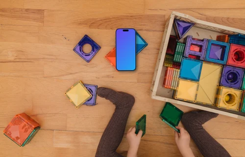 Children's play area mockup with smartphone and colorful toys