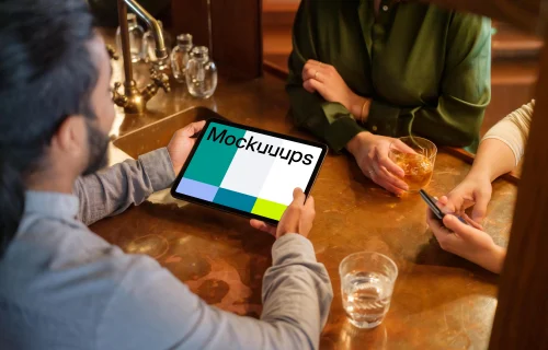 Colleagues in the lounge with iPad mockup