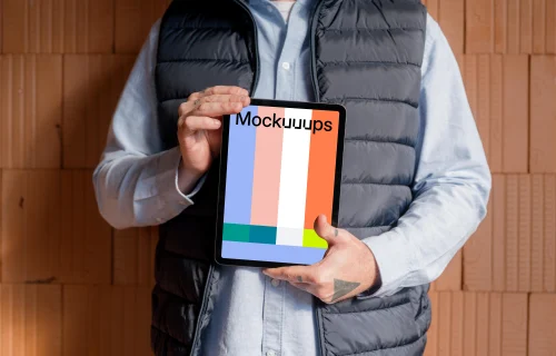 Construction worker confidently holding an iPad mockup