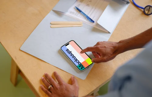 Doctor typing on the iPhone mockup