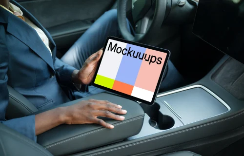 Entrepreneur holding an iPad Air mockup in Tesla