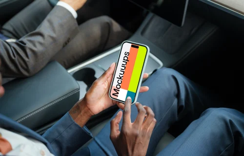 Entrepreneurs in Tesla with iPhone 14 Pro mockup