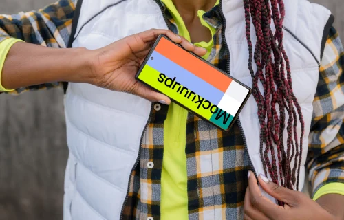 Female construction worker with a smartphone in her hand