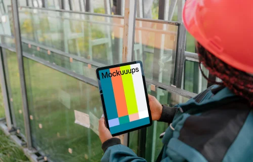 Female construction worker with an iPad in her hands