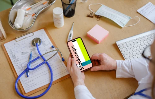 Female doctor holding an iPhone