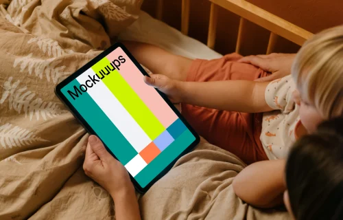 Female hand holding a tablet mockup