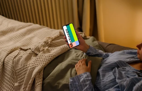 Female hand holding an iPhone mockup