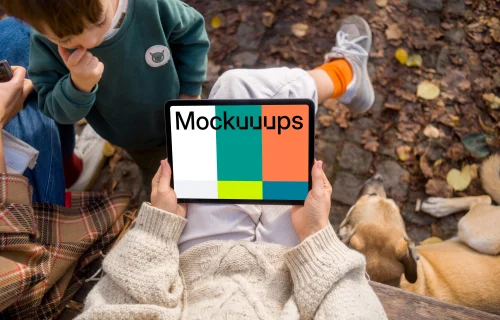 Female hands holding an iPad Air in autumn season mockup