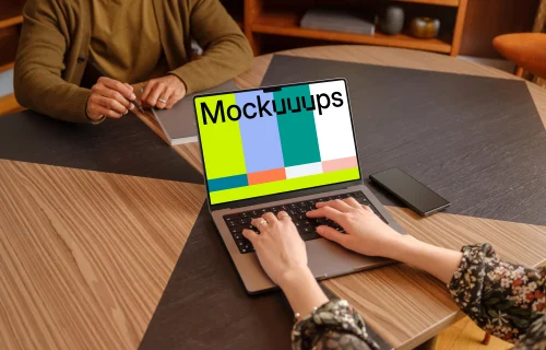Female typing on a MacBook Pro mockup in the office
