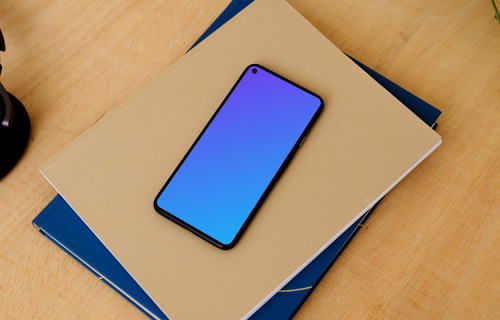 Google Pixel mockup stacked on a pair of notepads