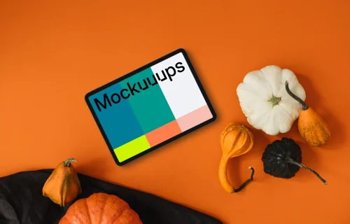 Halloween background mockup with tablet and pumpkins