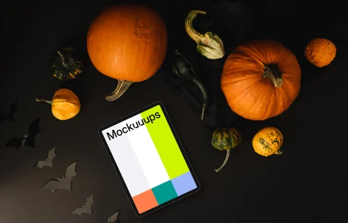 Halloween pumpkin mockup with a tablet on the dark background