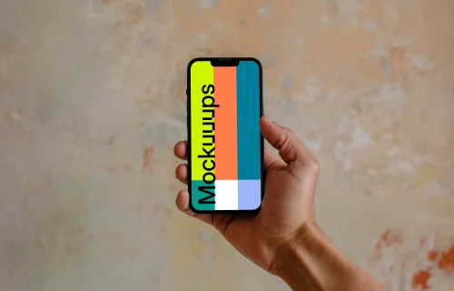 Hand holding iPhone 13 mockup