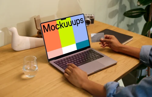 Hand typing on a MacBook Pro mockup