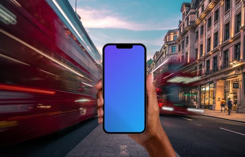 Holding smartphone mockup on the street