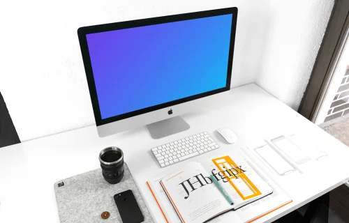iMac mockup on white working desk