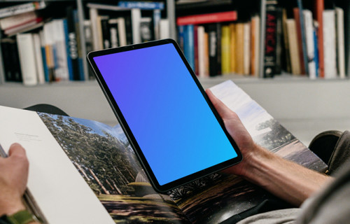 iPad Air mockup held by user in a library