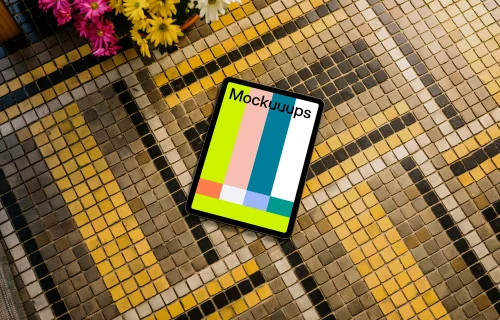iPad Air mockup on a colorful garden paving with flowers