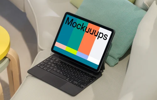 iPad Air mockup on a cozy couch with colorful cushions