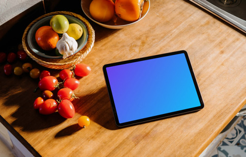 iPad Air mockup on a table beside some tomatoes